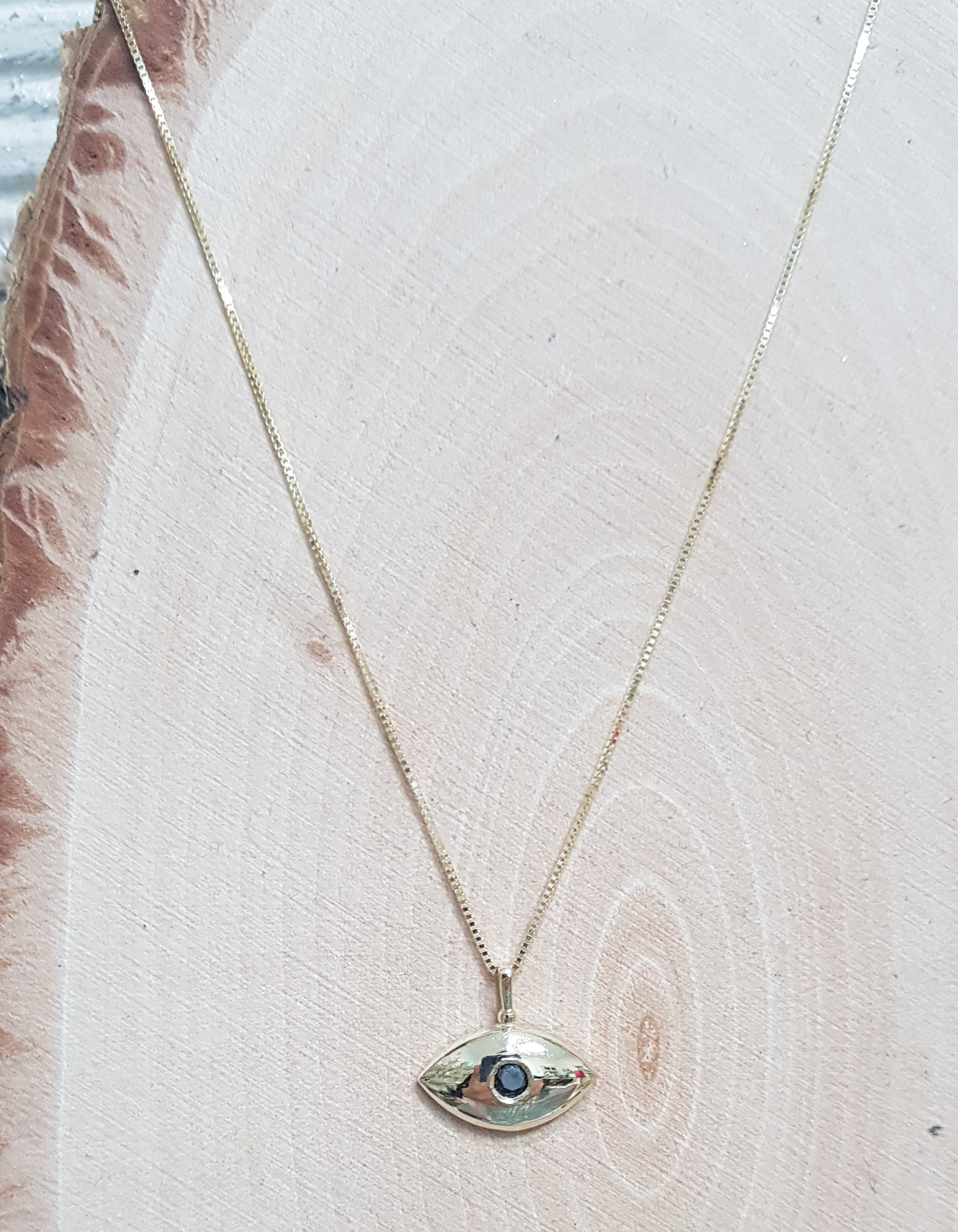 Elegant Enigma – Eye-shaped Gold Necklace - AlmaJewelryShop
